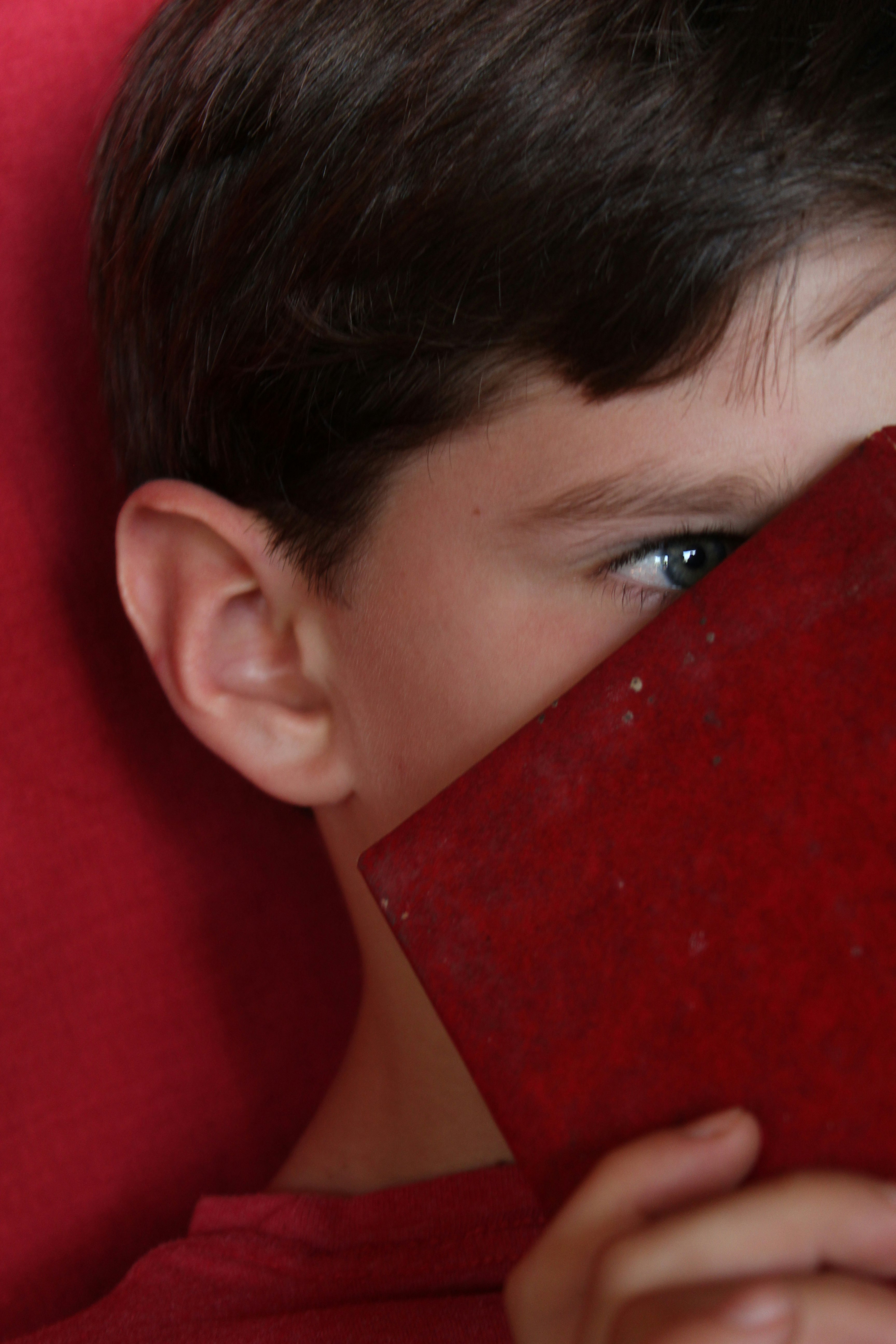 person holding red rectangular plastic